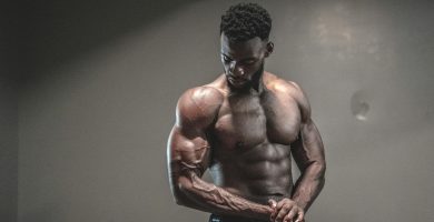 photo of man with muscular body